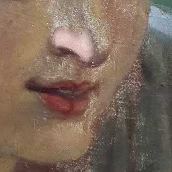 L’un des visages avant puis après retouche des usures.