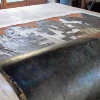 Retournement de la toile sur un rouleau